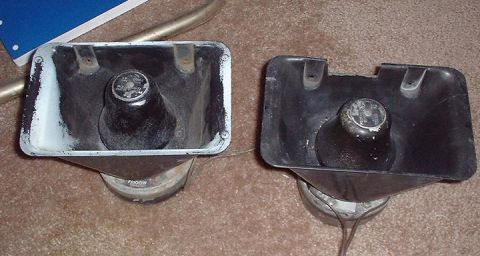1997 Ford Crown Victoria - Two car horns are shown, one with a chrome-plated interior and the other with a black plastic housing.