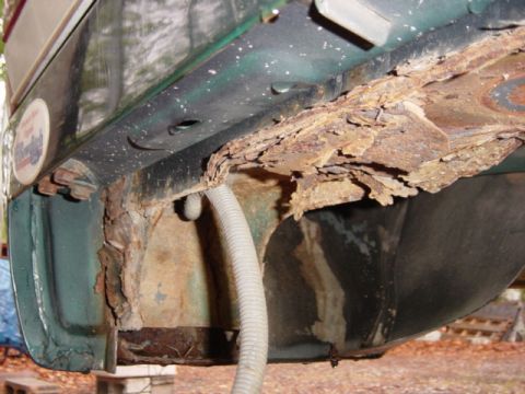 1991 Ford Bronco - Significant rust and corrosion are visible on the vehicle's frame, indicating structural damage.