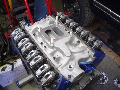 1984 Ford Bronco - Close-up view of a V8 engine's intake manifold and valve train components.