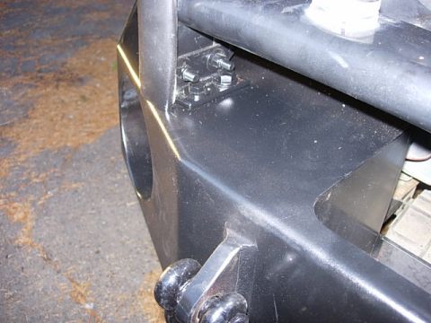 1993 Ford Bronco - Detail of an aftermarket bumper assembly, showing mounting hardware and a tow hitch.