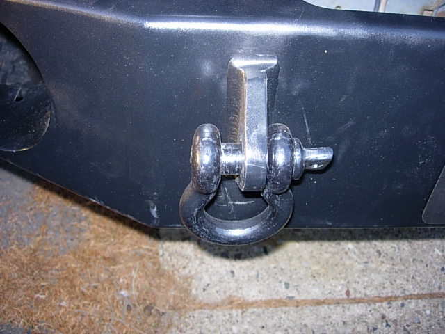 Black D-ring shackle mounted to welded tab on black steel bumper