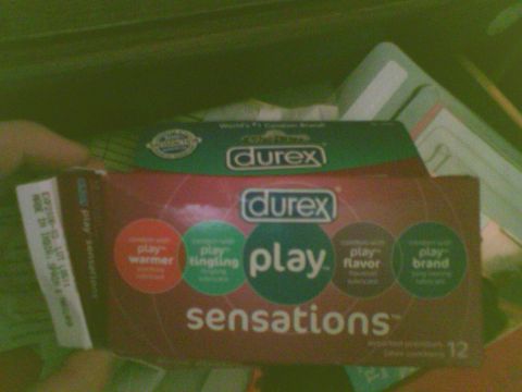 1985 Ford F-150 - A box of Durex Sensations condoms is shown, with various "play" variations listed on the packaging.