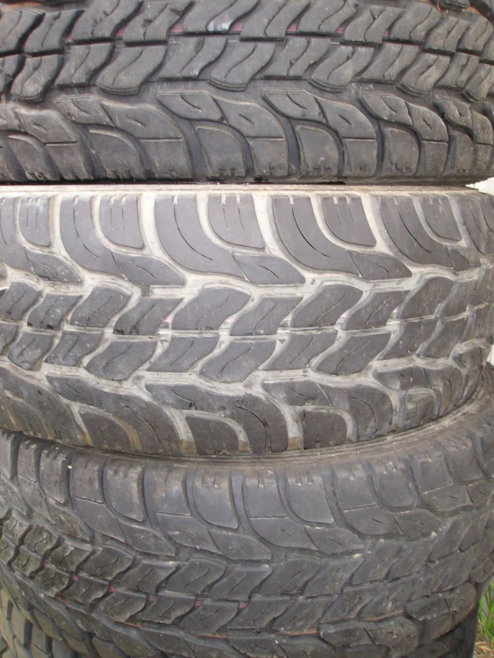 stack of four off-road tires