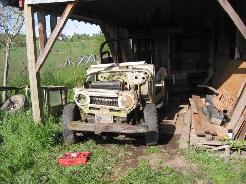 1991 Ford Explorer - This Toyota Land Cruiser FJ40 is in rough condition and parked in a barn-like structure.