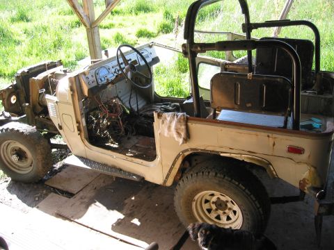1991 Ford Explorer - This vintage Toyota Land Cruiser is undergoing restoration, with its interior and engine bay exposed.