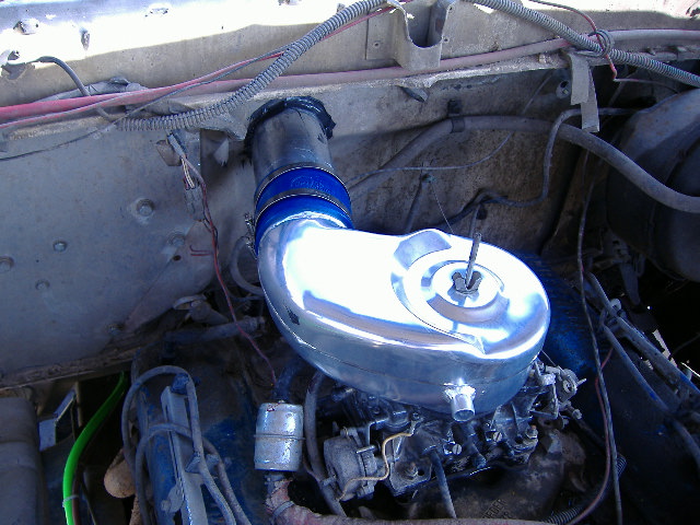 Chrome air intake assembly in engine bay