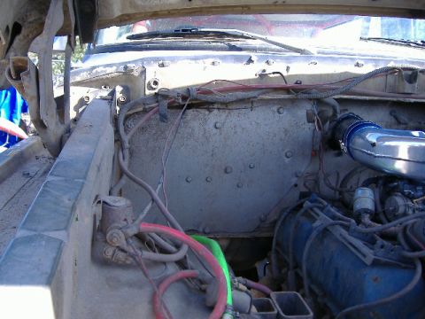 1979 Ford Bronco - Close-up of an engine bay, focusing on the intake system and surrounding components.