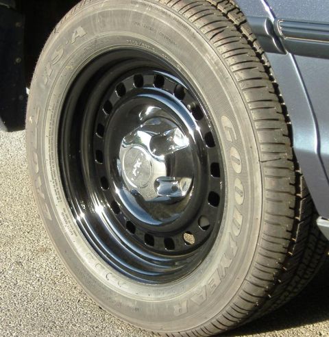 1996 Ford Crown Victoria - This photo shows a close-up of a vehicle's wheel and tire, not the entire car.