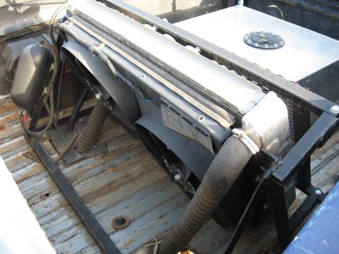1977 Ford F-150 - Custom radiator and fan setup installed in the bed of a pickup truck.