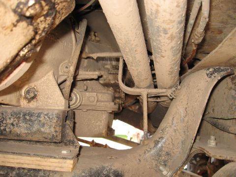 1977 Ford F-150 - Close-up of the undercarriage, showing the transmission and exhaust system components.