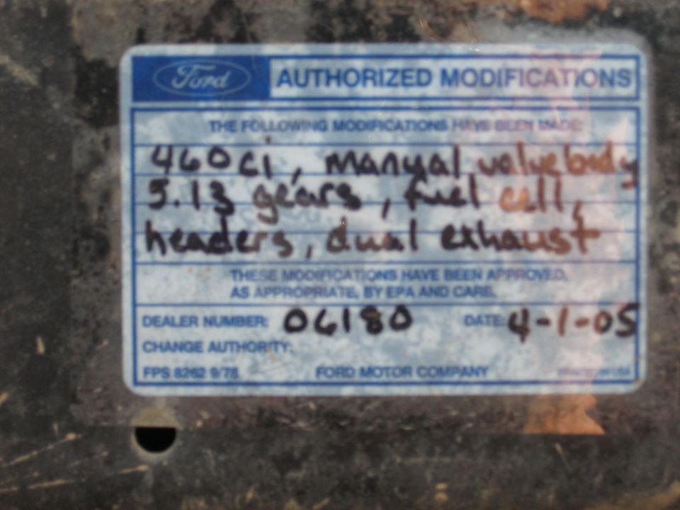 Ford authorized modifications sticker detailing 460ci, manual valve body, 5.13 gears, fuel cell, headers, and dual exhaust. Dated 4-1-05