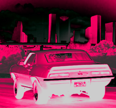 1993 Ford Bronco - Rear view of a 1969 Chevrolet Camaro SS with a city skyline behind it.