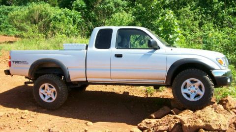 1993 Ford Bronco - This Toyota Tacoma pickup truck, likely from the late 1990s, is shown off-road.