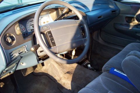 1993 Ford Taurus - Interior view of a 1993 Ford Taurus, showing the dashboard, steering wheel, and seats.