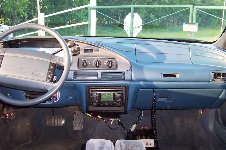 1993 Ford Taurus interior showing dashboard, steering wheel, radio, and pedals