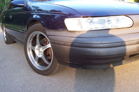 1993 Ford Taurus - Front quarter view of a dark blue 1993 Ford Taurus sedan.