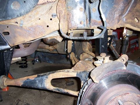 1996 Ford Bronco - The vehicle's suspension system shows significant rust and wear, indicating it is not a 1996 model.