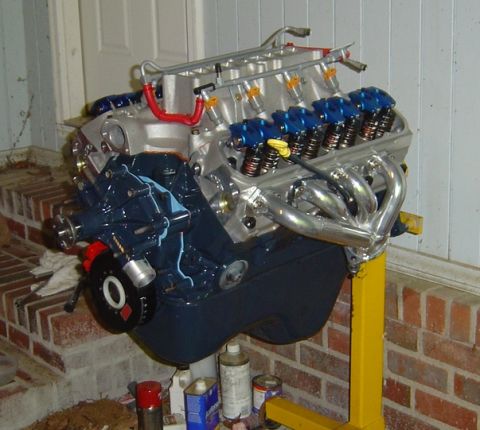 1986 Ford Bronco - V8 engine on a stand, likely undergoing a swap or rebuild.