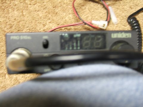 1998 Ford Taurus - A Uniden PRO 510XL CB radio is shown, with its digital display and microphone cable visible.