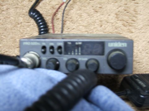 1998 Ford Taurus - A Uniden PRO 520XL CB radio is shown, multiple knobs and a digital display for channel selection.