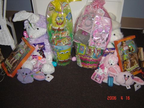 1993 Ford Bronco - Easter baskets filled with candy and toys, alongside plush bunnies and Shrek merchandise, are displayed on the floor.