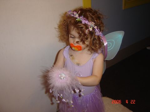 1993 Ford Bronco - Child in a fairy costume with a pacifier and a fluffy wand is pictured.