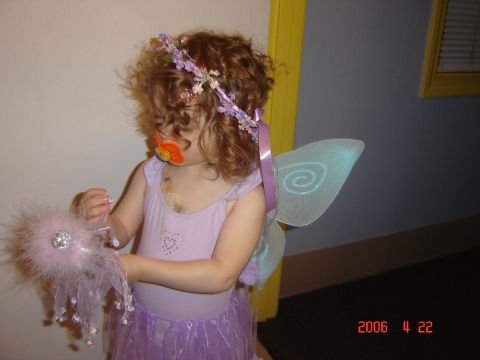 1993 Ford Bronco - A young child dressed as a fairy poses for a photo indoors.