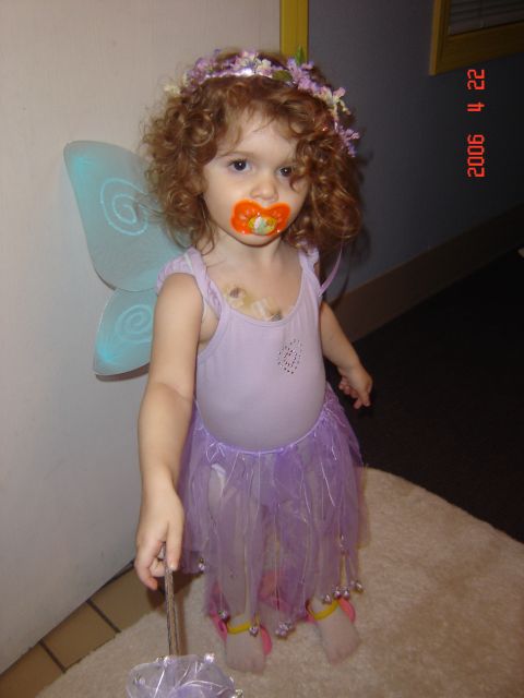 1993 Ford Bronco - Child dressed as a fairy with a pacifier and wings.