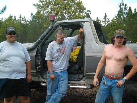 1986 Ford Bronco - Three men pose with a modified 1986 Ford Bronco a snorkel intake.