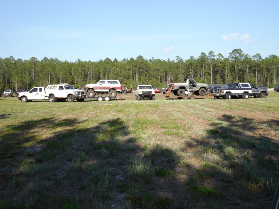 1989 Ford Bronco on trailer, side view, red and white