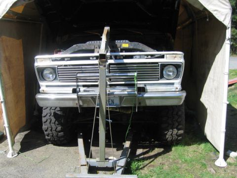 1976 Ford F-150 - after undoing old motor mounts, raise engine to clear the way.