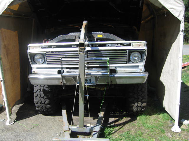 after undoing old motor mounts, raise engine to clear the way.