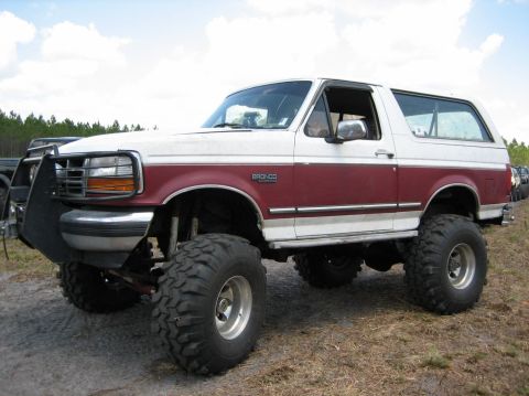 1989 Ford Bronco - This lifted Ford Bronco is ready for off-road adventures with its aggressive tires and front brush guard.