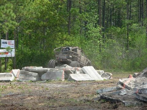 1989 Ford Bronco - Custom off-road vehicle tackles a challenging obstacle course made of concrete debris.