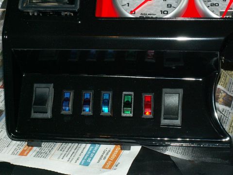 1983 Ford Bronco - left switch panel..(L to R) headlights, spot-spread, spot-pencil, spots-roof, spare, winch on/off isolator, winch control in/out.