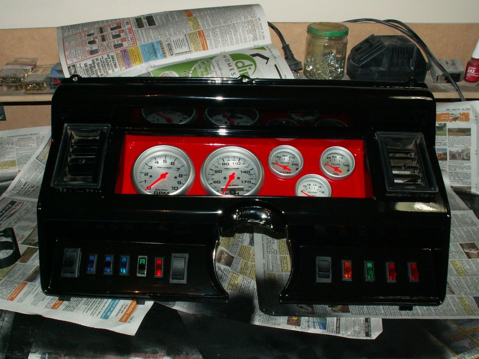 the dash mocked up for looks....still clearcoat to go....mount gauges properly in a weeks time once paint hardened properly....new airvents yet to cometo finish it off.