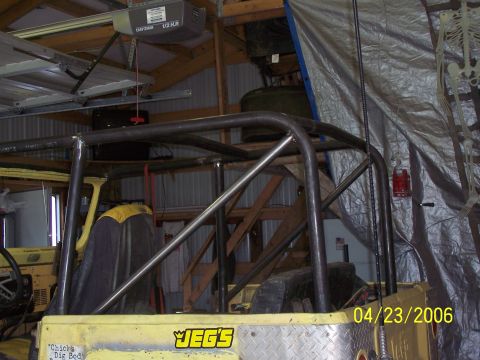 1982 Ford Customline - Custom roll cage installed in a yellow Jeep, with a JEG'S sticker on the dashboard.