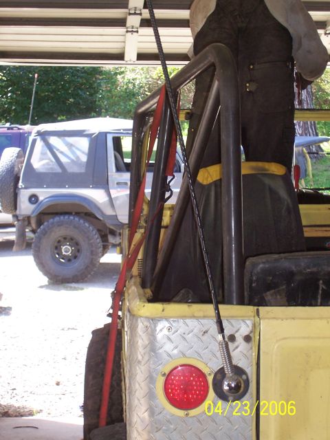 1982 Ford Customline - Two off-road vehicles are parked side-by-side, one yellow and one silver, with a roll cage visible on the yellow vehicle.