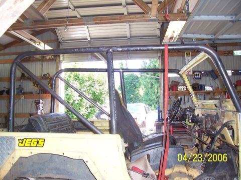 1982 Ford Customline - A custom roll cage is installed inside a vehicle, with a JEG'S logo on the dashboard.