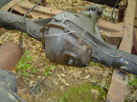1979 Ford Bronco - Close-up view of a vehicle's rear axle assembly, including the differential housing and axle tubes.