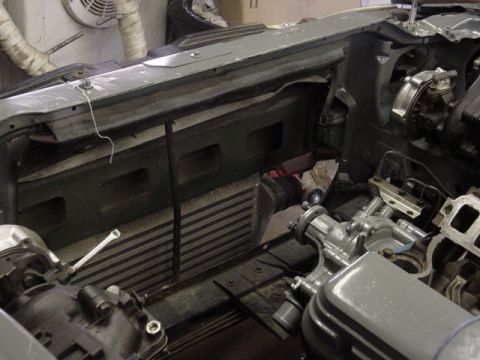 1995 Ford Mustang - Close-up view of engine bay modifications, including an intercooler and turbocharger.