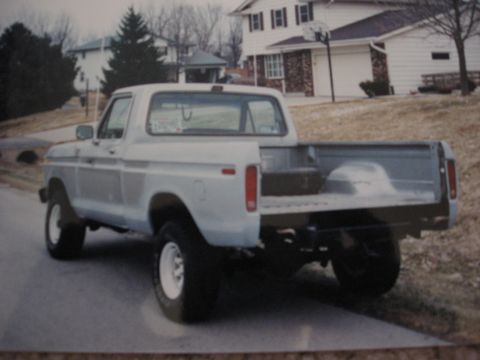 1977 Ford F-150 - This 1977 Ford F-150 pickup truck is seen from the rear, parked on a residential street.