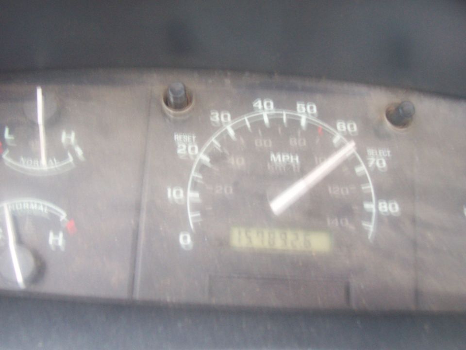 Dusty Ford truck gauge cluster with 85 mph speedometer and roughly 259,935-mile odometer