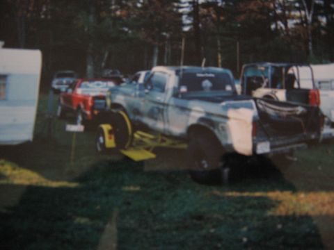 1977 Ford F-150 - Custom painted 1977 Ford F-150 pickup truck is parked outdoors with other vehicles nearby.