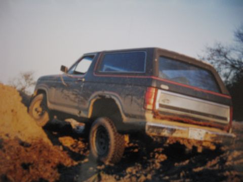 1977 Ford F-150 - This Ford Bronco is shown off-roading on a dirt incline.
