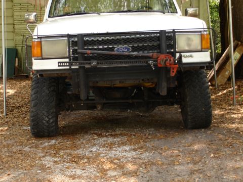 1989 Ford Bronco - This 1989 Ford Bronco is equipped with a bull bar and a Hi-Lift jack, ready for off-road adventures.