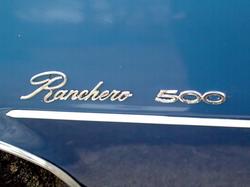 1975 Ford Ranchero - The side of a blue vehicle displays the 'Ranchero 500' badging.