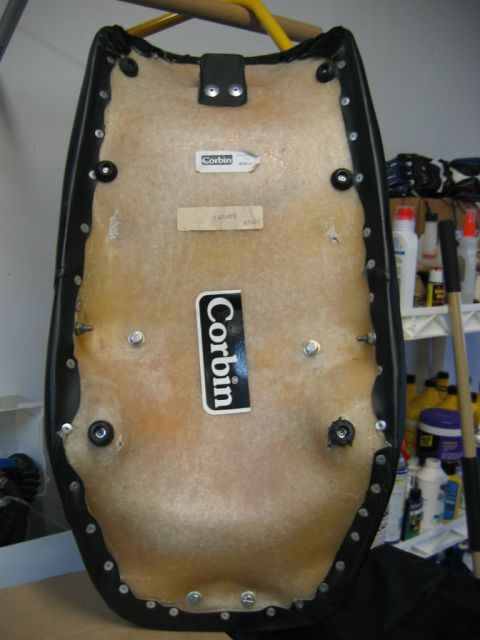 1985 Ford LTD Crown Victoria - The underside of a Corbin motorcycle seat shows its construction and branding labels.