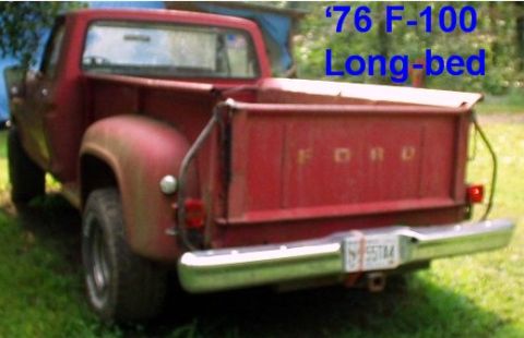 1976 Ford F-100 - This 1976 Ford F-100 pickup truck is viewed from the rear, displaying its classic tailgate and chrome bumper.