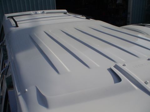1993 Ford C-350 (Centurion Conversions) - Close-up of a truck's roof, showing primer and raised ridges.